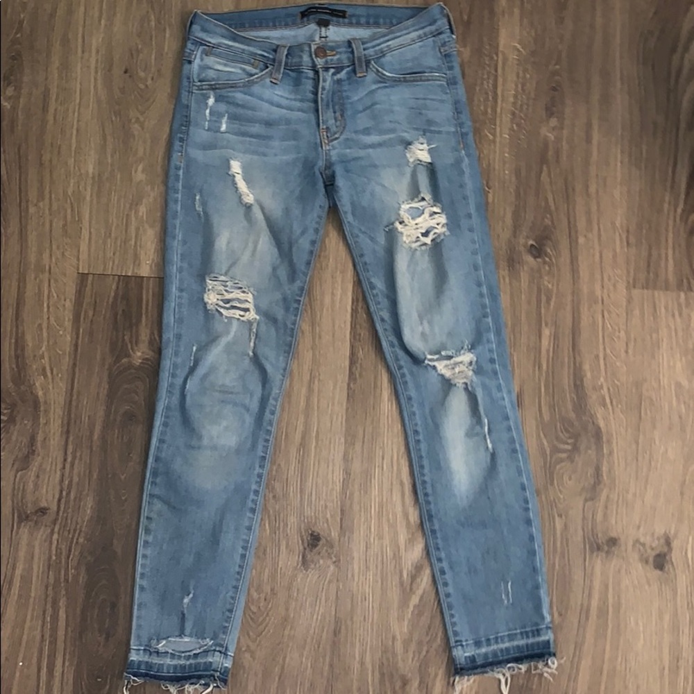 Flying monkey ripped blue jeans